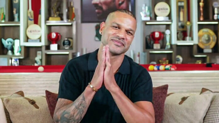 Shikhar Dhawan A serious close-up portrait of Shikhar Dhawan, with a background that suggests legal or investigative themes, suitable for social media.