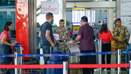 Authorities are investigating the source of the threatening emails that have caused widespread concern. Police cordon tape in front of a modern school building with a somber atmosphere.