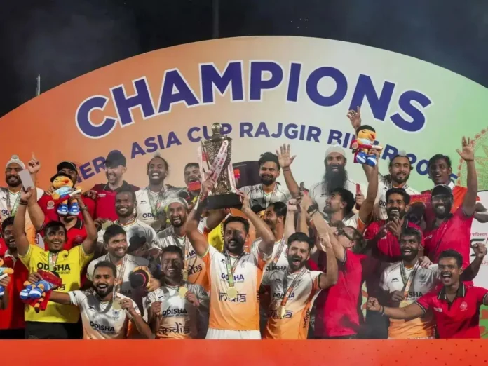 The Golden Moment A close-up of a gold medal or a trophy, with a subtle reflection of an Indian flag, representing the championship win.